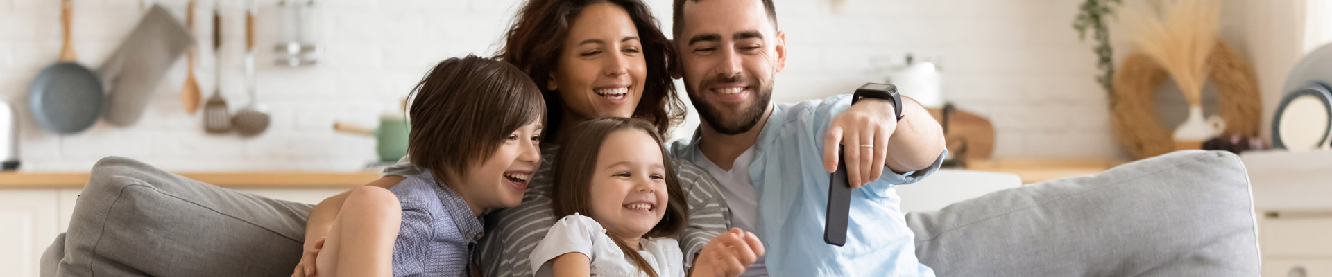 Family smiling with cell phone